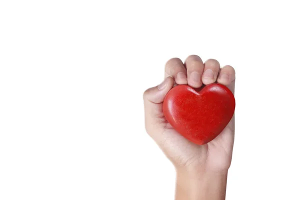 Руки держат красное сердце, здоровье сердца — стоковое фото