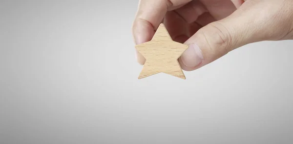 Hand of putting increase wood five star shape — Stock Photo, Image