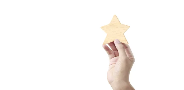Mão de colocar aumento de madeira forma de cinco estrelas — Fotografia de Stock