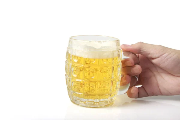 Glass of a beer in hand isolated — Stock Photo, Image