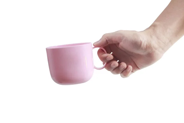 Mão segurando copo de plástico como um derramamento — Fotografia de Stock