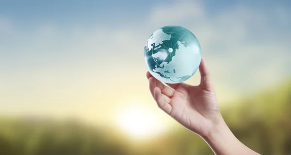 Globe ,earth in human hand, holding our planet glowing — Stock Photo, Image