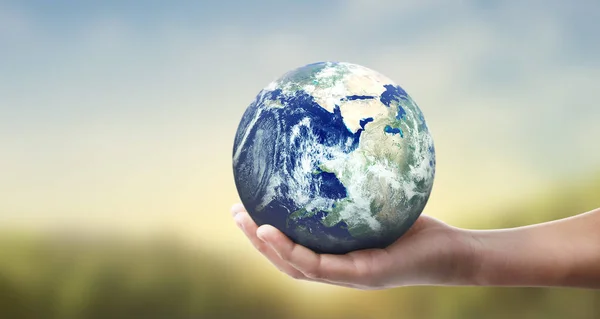 Globe ,earth in human hand, holding our planet glowing — Stock Photo, Image