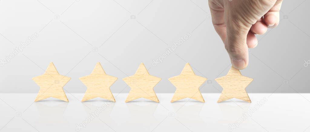Hand of putting increase five a star shape.The best excellent business services rating customer experience concept
