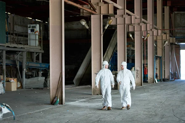 Full Length Portrait Two Workers Wearing Protective Suits Walking Workshop — Stock Photo, Image
