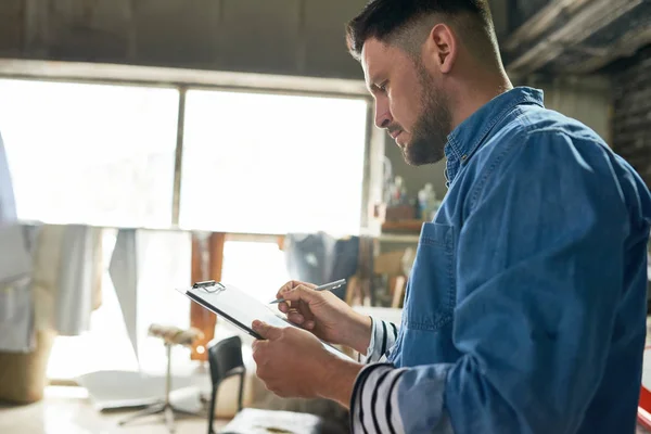 Side View Portrait Handsome Mature Man Writing Clipboard While Working — Stock Photo, Image