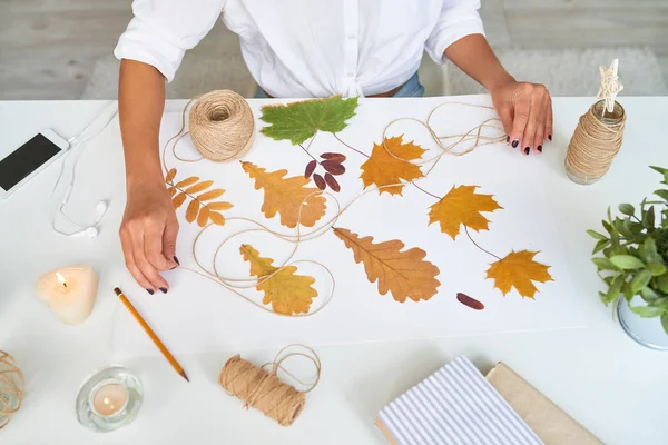 Top View Female Hands Making Handmade Autumn Leaves Composition Interior — Stock Photo, Image