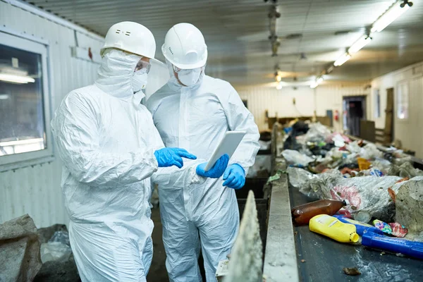Portrait Two Workers Wearing Biohazard Suits Using Digital Tablet Standing — Stock Photo, Image