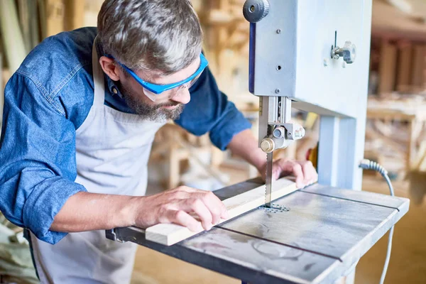 Portrait Mature Bearded Carpenter Carefully Placing Piece Wood Cutting Machine — Stock Photo, Image