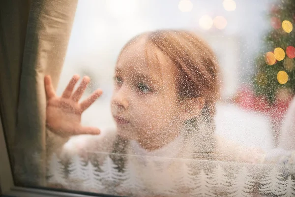 Pretty Little Girl Wearing Knitted Sweater Looking Out Window Covered — Stock Photo, Image