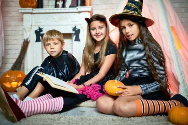 Smiling Pretty Children Costumes Sitting Floor Teepee Looking Camera While — Stock Photo, Image