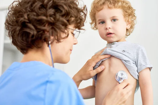 Portrait Female Doctor Listening Childs Breathing Using Stethoscope Stock Photo