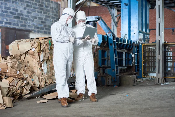 Full Length Portrait Two Workers Wearing Biohazard Suits Using Laptop — Stock Photo, Image