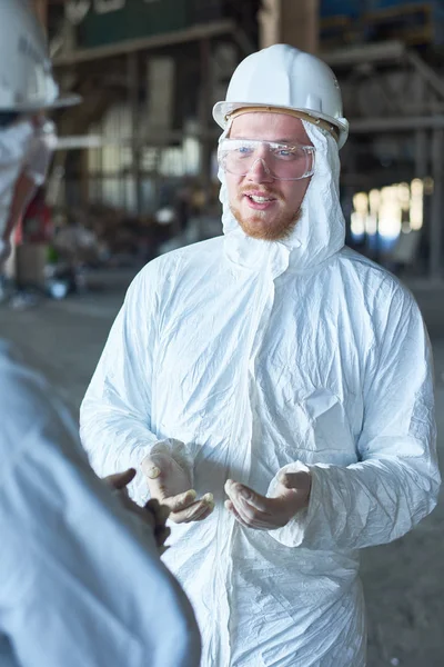 Portrait Young Worker Wearing Biohazard Suit Standing Industrial Warehouse Modern — Stock Photo, Image