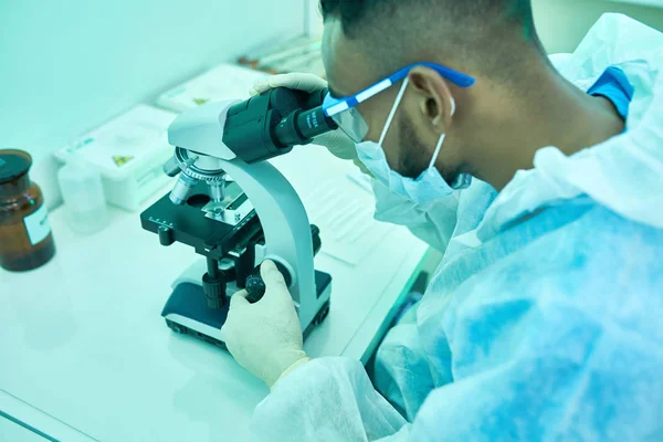 High Angle Portrait Young Middle Eastern Scientist Using Microscope While — Stock Photo, Image