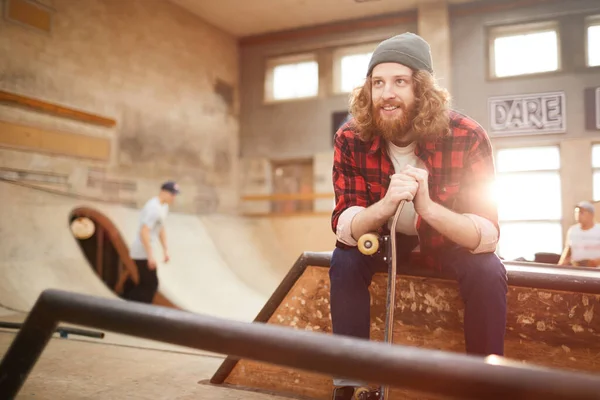 Portrait Contemporary Bearded Man Looking Away Smiling While Siting Ramp — Stock Photo, Image
