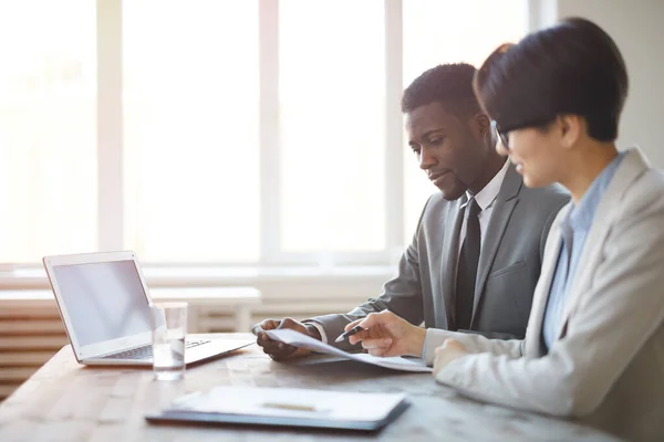 Side View Portrait Young African Businessman Reading Documents Female Colleague — Stock Photo, Image