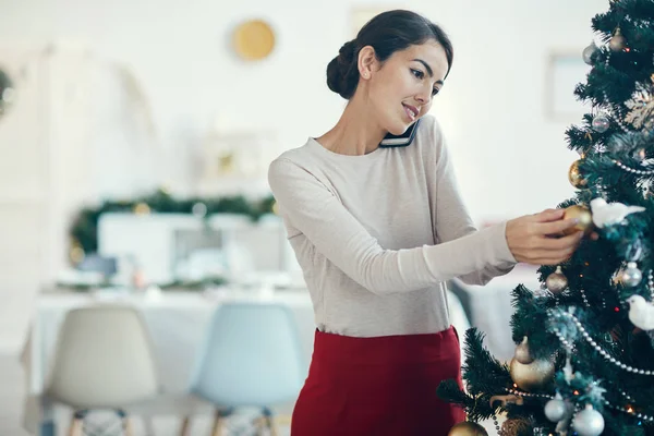 Portrait Elegant Young Woman Speaking Phone While Decorating Christmas Tree — Stock Photo, Image
