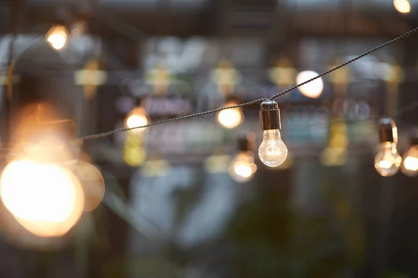 Background Image Outdoor Lighting Garlands Focus Classic Light Bulb Wiring — Stock Photo, Image
