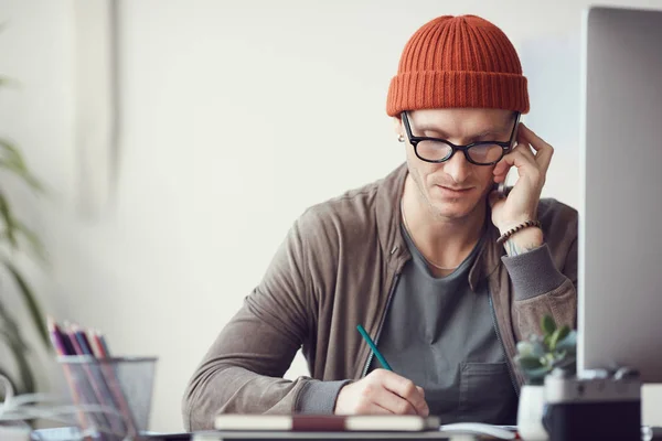 Portrait Contemporary Businessman Wearing Glasses Beanie Speaking Smartphone While Working — 스톡 사진