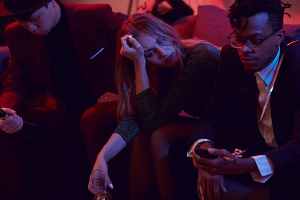 Portrait Sad Young Woman Holding Champagne Glass While Siting Sofa — Stock Photo, Image