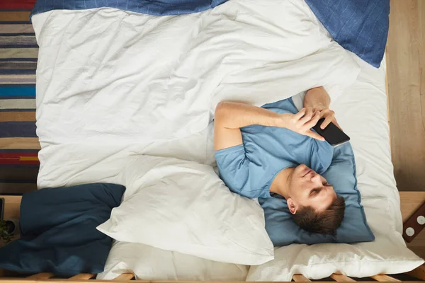 View Portrait Modern Young Man Using Smartphone While Lying Bed — Stock Photo, Image
