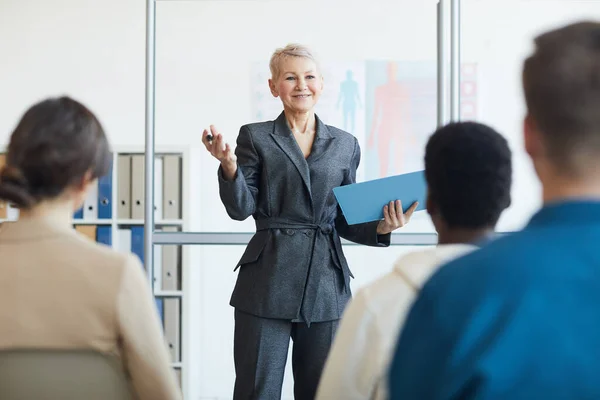 Portrait Smiling Female Business Coach Giving Speech Audience Seminar Copy — Stock Photo, Image