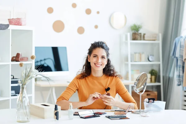 Cheerful Young Adult Woman Sitting Table Beauty Products Looking Camera — Stock Photo, Image