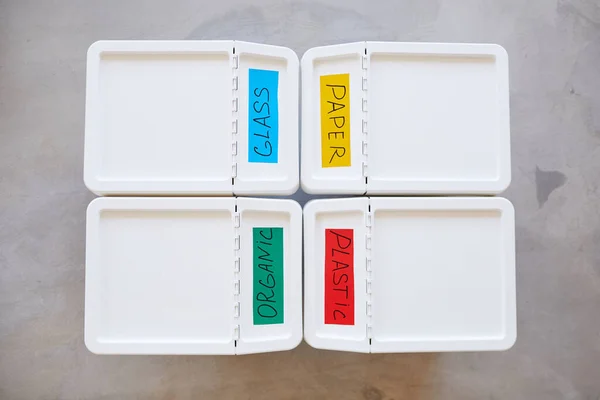 Minimal Top View Composition Four Plastic Bins Labeled Storage Sorting — Stock Photo, Image