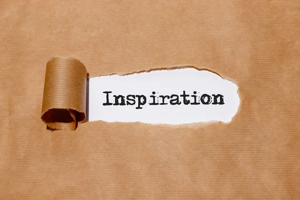 "Inspiration" behind torn paper — Stock Photo, Image