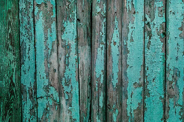 Fundo de madeira com uma textura turquesa rachada velha, espaço para texto — Fotografia de Stock