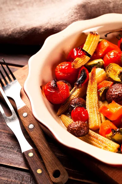 Spicy hot vegetables grilled in a ceramic bowl. Vegetable-mushroom blends. Close-up