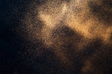 Altın parıltılı siyah arka plan. Bulanık etki. Şenlikli arka plan veya proje için konsept