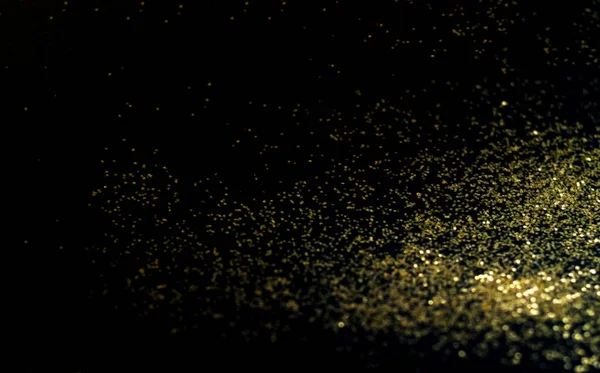 Black background with golden sparkles. Blurred effect. Concept for festive background or for project.Copy space — Stock Photo, Image