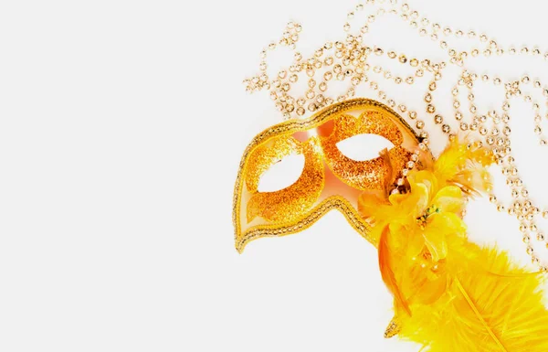 Golden Carnival mask on white background with silver beads. Mardi Gras concept — Stock Photo, Image