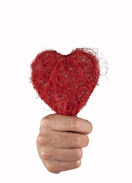 Fist holding a red heart with great force — Stock Photo, Image