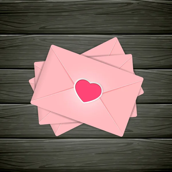 Zwarte houten achtergrond met roze Valentines enveloppen — Stockvector