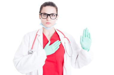 Serious doctor in medical coat making oath clipart