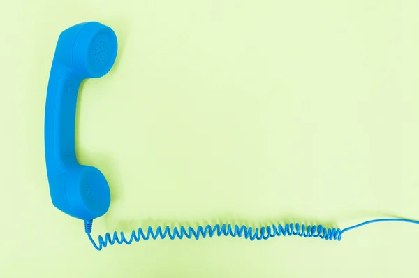 Retro telephone receiver with cord — Stock Photo, Image