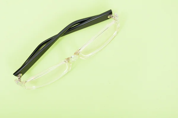 One pair of sight glasses on green background — Stock Photo, Image