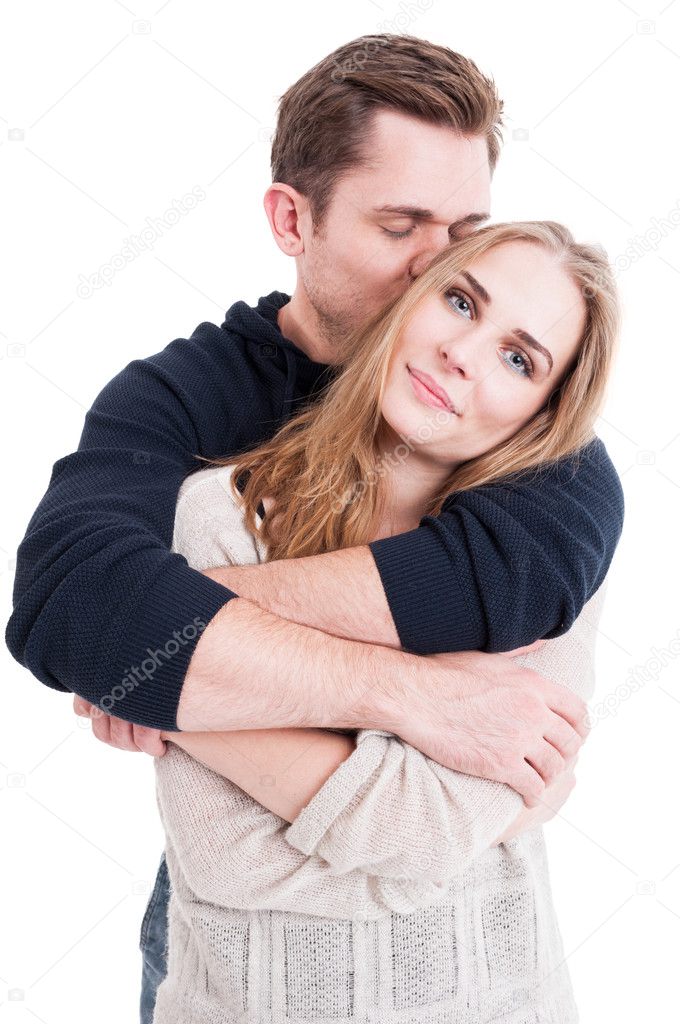 Man kissing and hugging her beautiful lady