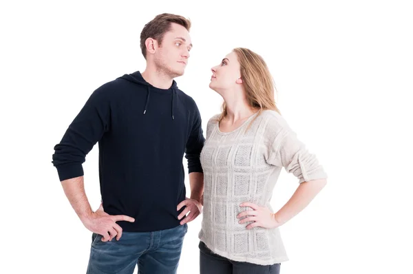 Couple looking at each other with arms on hips — Stock Photo, Image