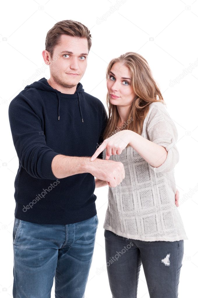Couple posing and showing wrist watch  