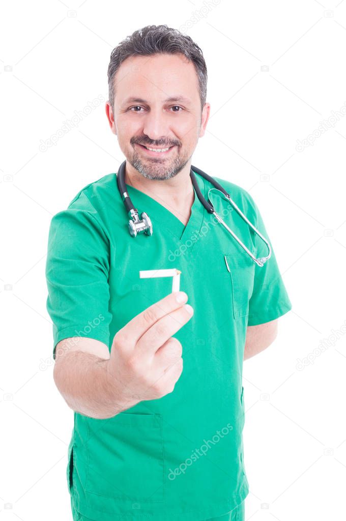 Young male medic holding a broken cigarette