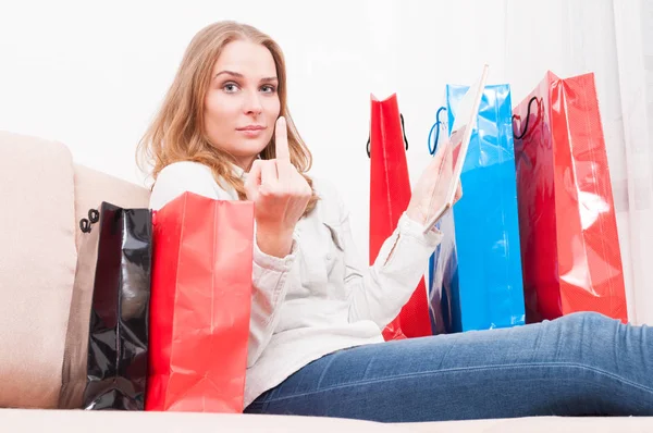 Lady shopping online and showing obscene gesture — Stock Photo, Image