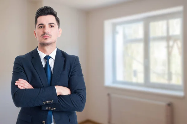 Portrait of young realtor with arms crossed — Stock Photo, Image