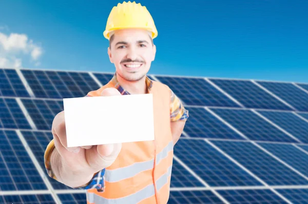 Joyful young engineer showing empty visit card — Stock Photo, Image