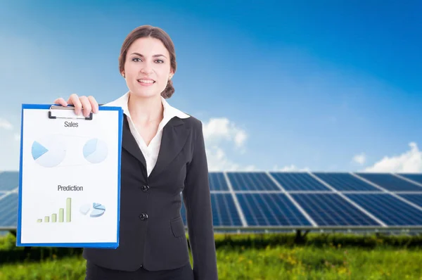 Happy female holding clipboard with diagrams — Stock Photo, Image