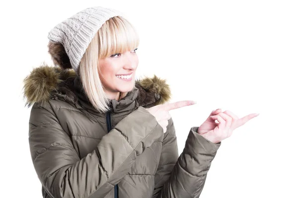 Cheerful young girl pointing finger at something — Stock Photo, Image