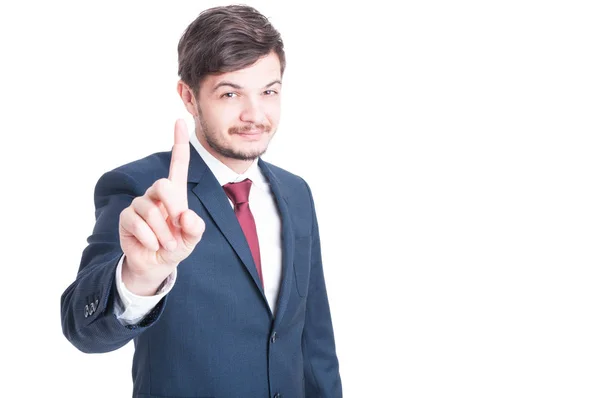 Smiling man wearing suit showing number one — Stock Photo, Image